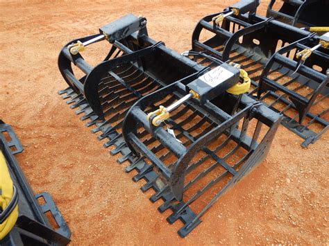 rake grapple skid steer attachment|used skid steer grapple.